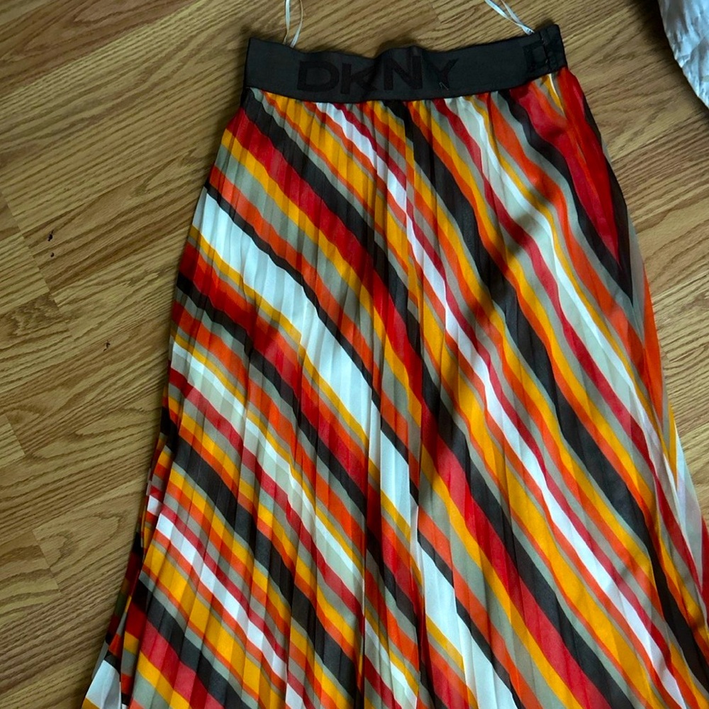 Dkny asymmetrical mid length skirt. Worn once. No stains and looks new.